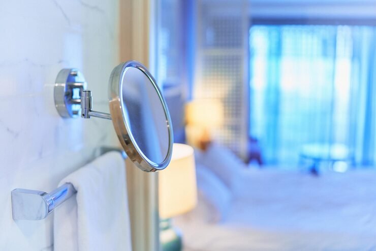 Magnifying mirror in bathroom context